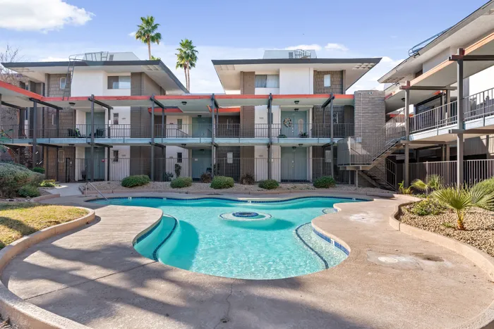 Clean and inviting pool area perfect for relaxing in the sun.