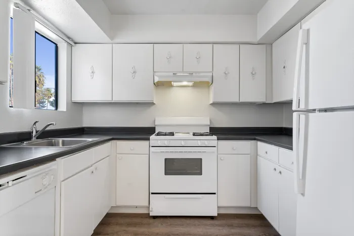 Polished kitchen with quality appliances and clean cabinets.