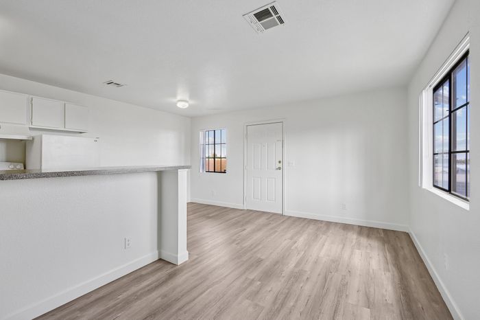 Bright and inviting open-plan living space with modern flooring and ample natural light.