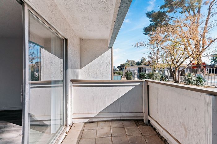 Charming apartment balcony with inviting outdoor view, perfect for relaxing and enjoying nature.