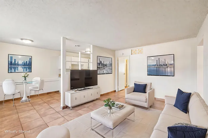 Bright and inviting living room with modern furniture, stylish decor, and a dining area, perfect for comfortable entertaining. Virtually staged for a contemporary feel.