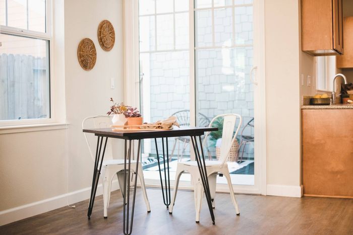 Bright breakfast nook with sliding glass door leading to patio.