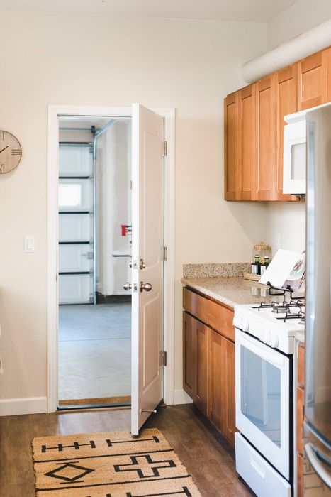 Galley kitchen door leading into the two car garage.