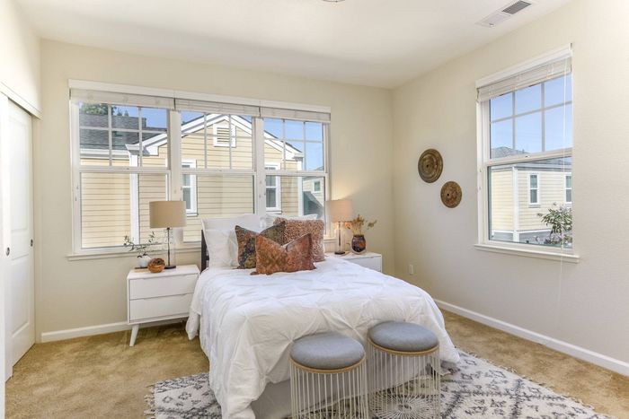 Bedroom with enormous windows for natural light.
