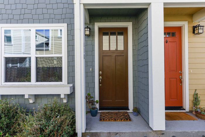 Front door highlighting two tone paint and beautiful shingle exterior.