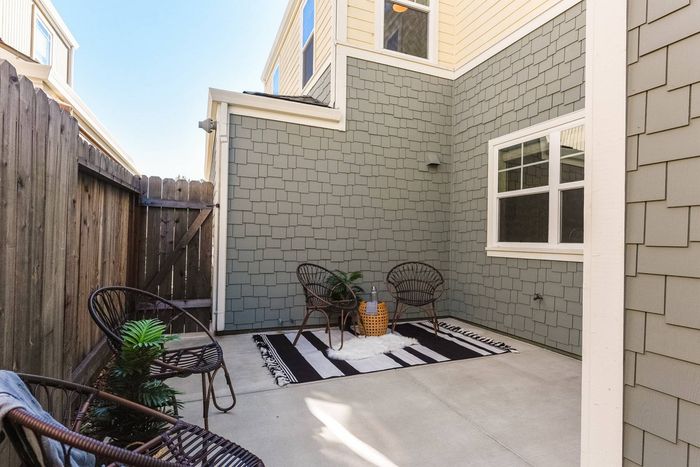 Back patio area with fencing for privacy.