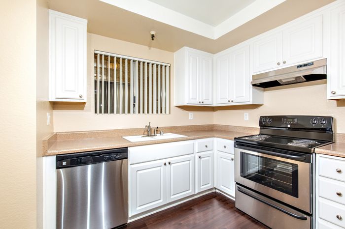 updated kitchen with stainless steel appliances including dishwasher