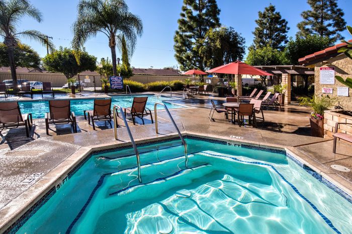 community spa with pool and lounge seating