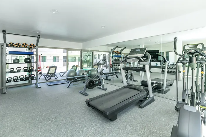 Community fitness center leading out to pool
