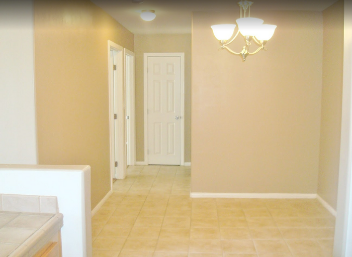 Bright dining area with ceramic tile flooring