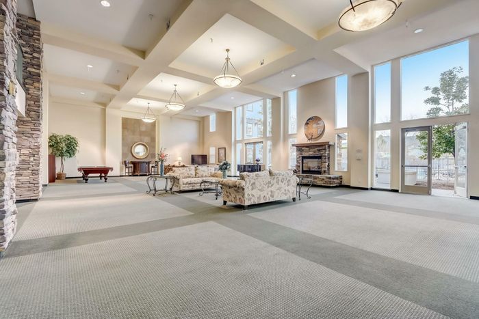 spacious clubhouse with floor to ceiling windows