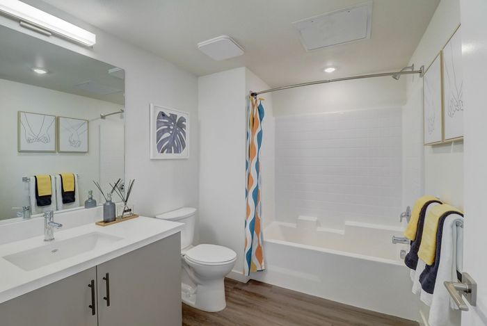 Full bathroom with shower tub combo at kelvin apartment community