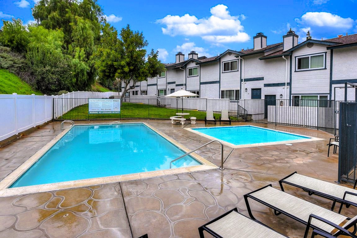 rectangular swimming pool with wadding pool adjacent to it