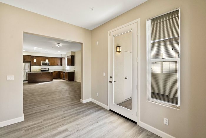 open kitchen with granite countertops and a kitchen island and stainless steel appliances