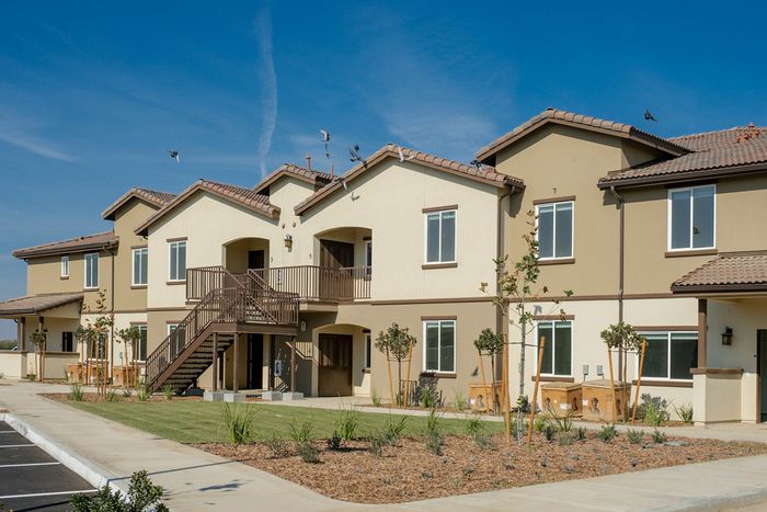exterior of two story apartment building at Grapevine Villa