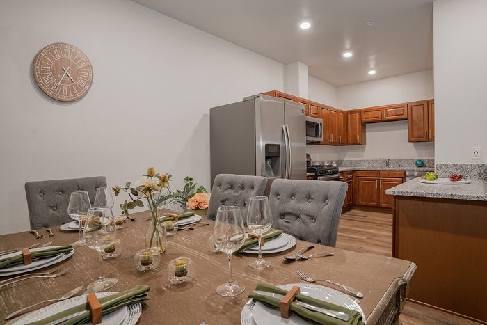 kitchen with stainless steel appliances and faux-wood like flooring