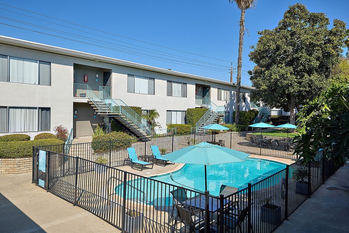 Pool and lounge area at Mission Arbor in San Diego, CA along with courtyard