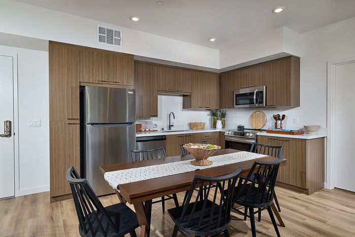 Spacious living, dining, and kitchen of Dezi Apartments in Serra Mesa, San Diego, CA