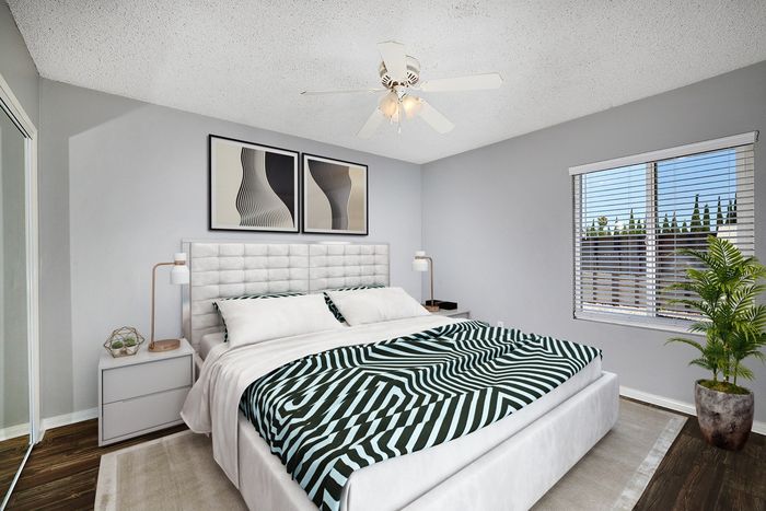 Virtually staged bedroom with large window