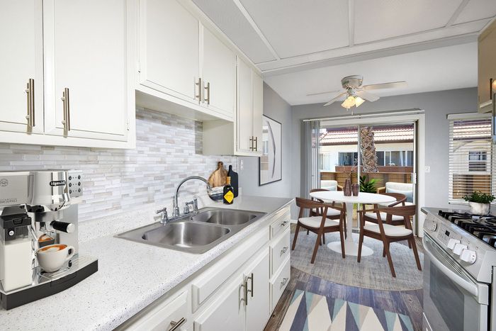 virtually staged renovated kitchen and dining room