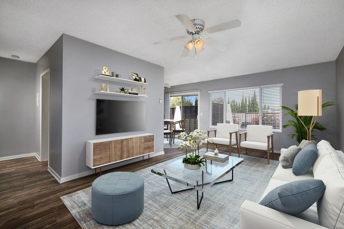 virtually staged living room leading out to patio
