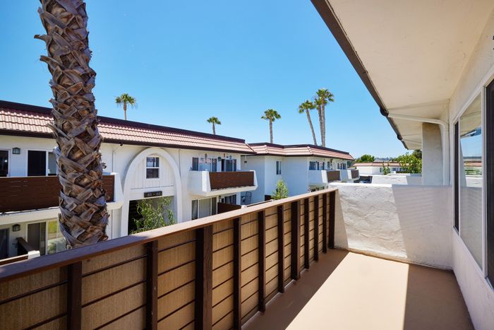 large balcony and view to well maintained community
