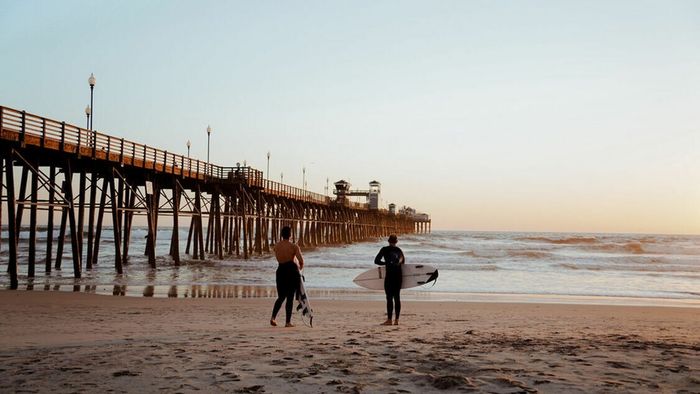 Surfers near oceanside pier
