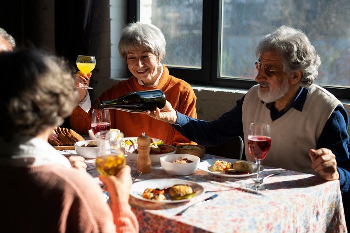 elder group of friends dining