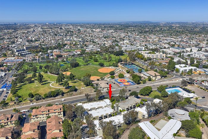 Drone aerial shot of Parkview Terrace Apartments and surrounding neighborhood reaching into horizon
