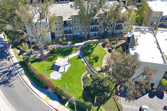 Drone aerial shot of Parkview Terrace Apartments showing property, trees, and lawn
