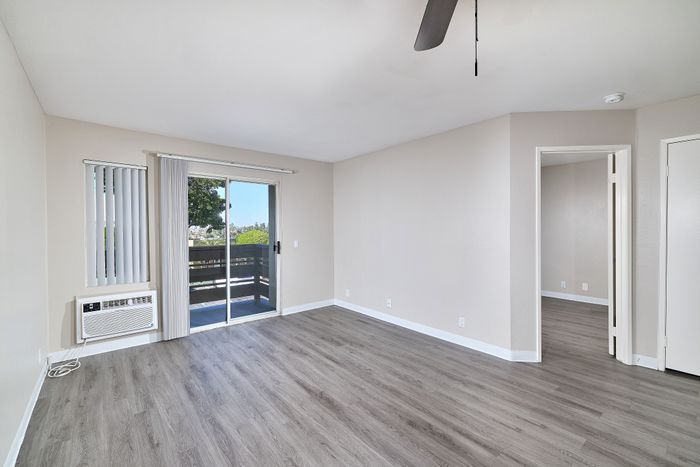 Apartment with wood floors and balcony