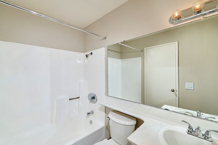 Bathroom with shower, tub, and sink