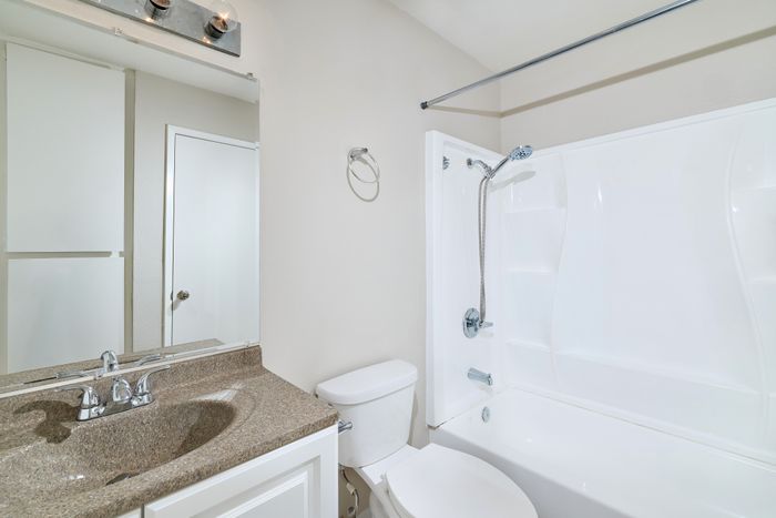 Bathroom with tub, shower, and sink