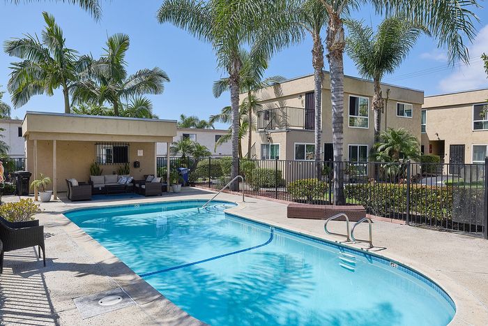 Another view of the pool at Pine Vista with a gazebo area with couches