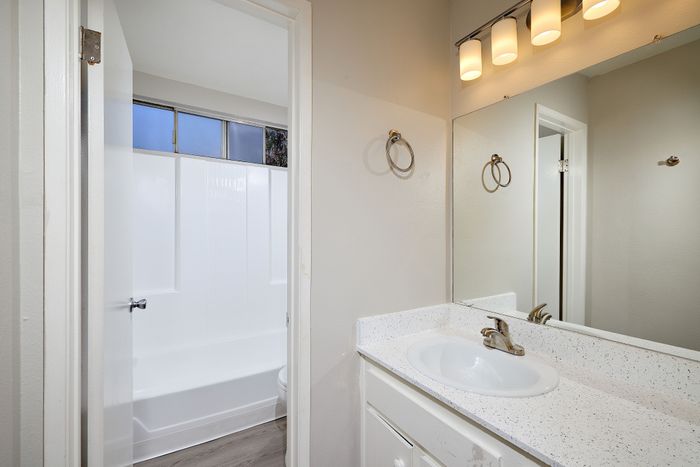 bathroom with tub and sink