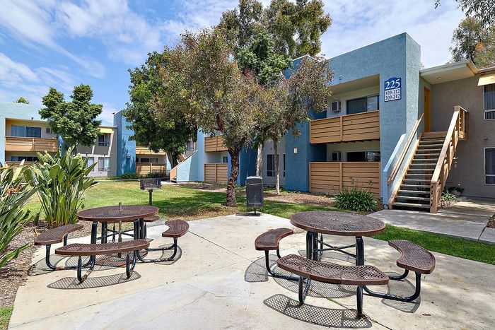 Community space with seating and trees.