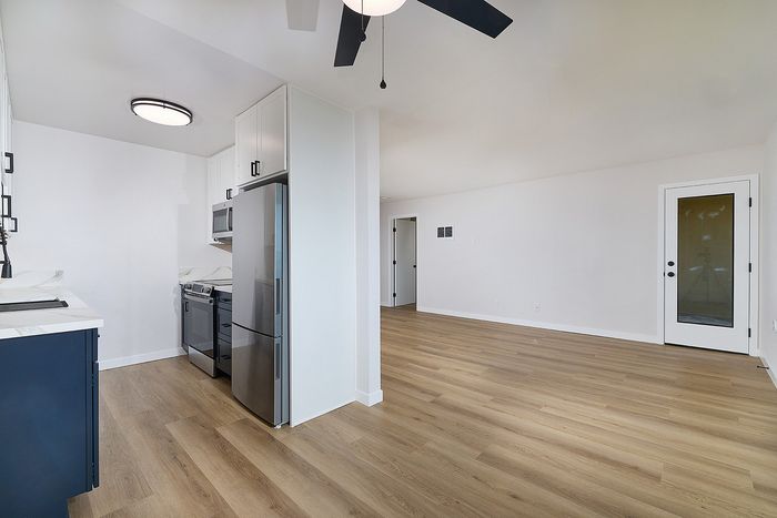 Dining room with view into the kitchen in unit 36 at Melrose Canyon