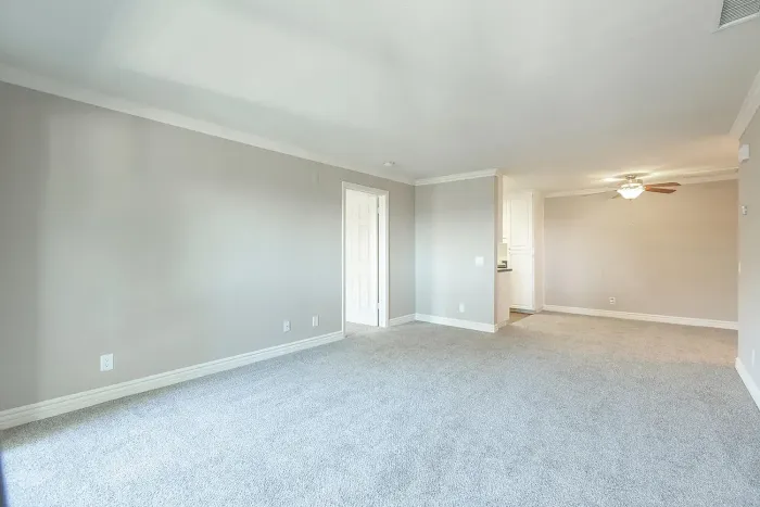 Spacious living room with neutral carpet at Elan - Scripps Terrace.