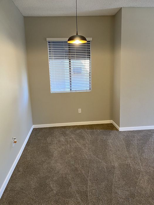 Spacious room with neutral carpet and natural light at Elan - Terraza La Jolla