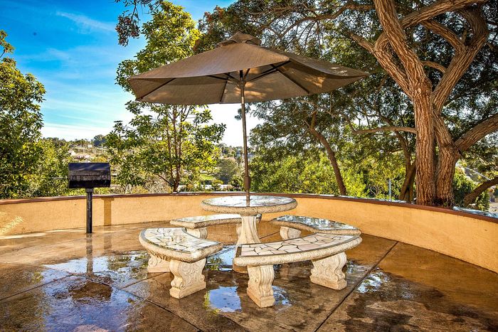 Community BBQ and picnic area with shaded seating at Elan - Solana Pointe.