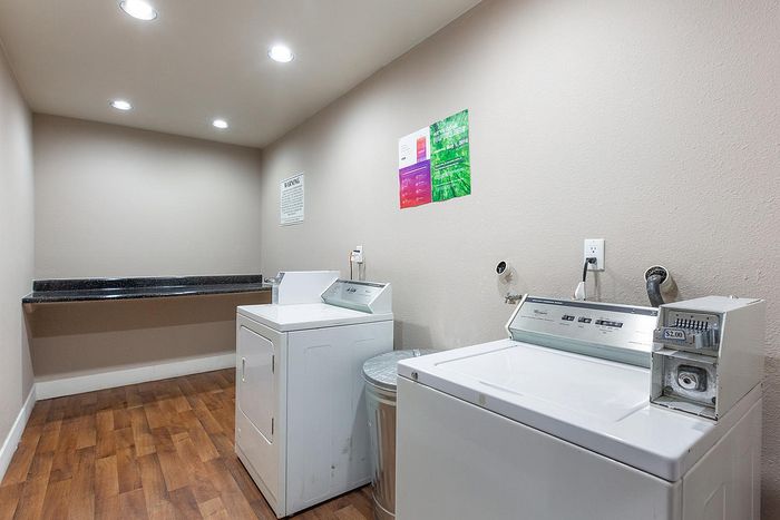 On-site full-service laundry facility with modern machines at Elan - pacific lofts