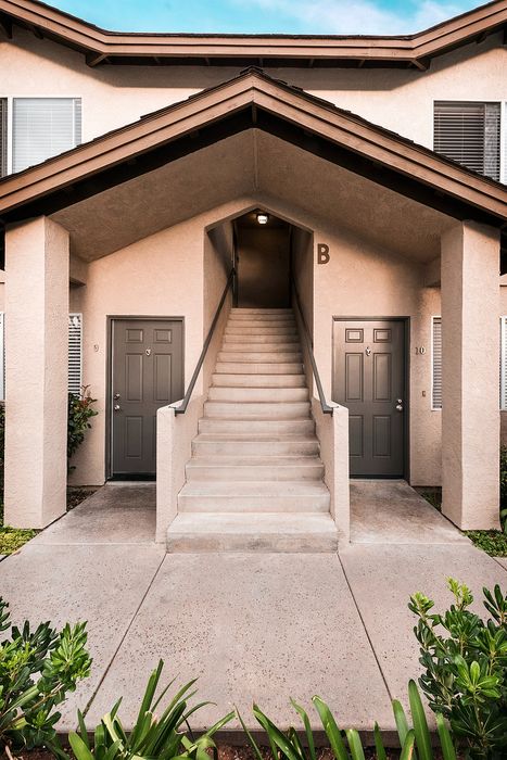 Architectural building entrance with unit doorways at Elan - poway hills.