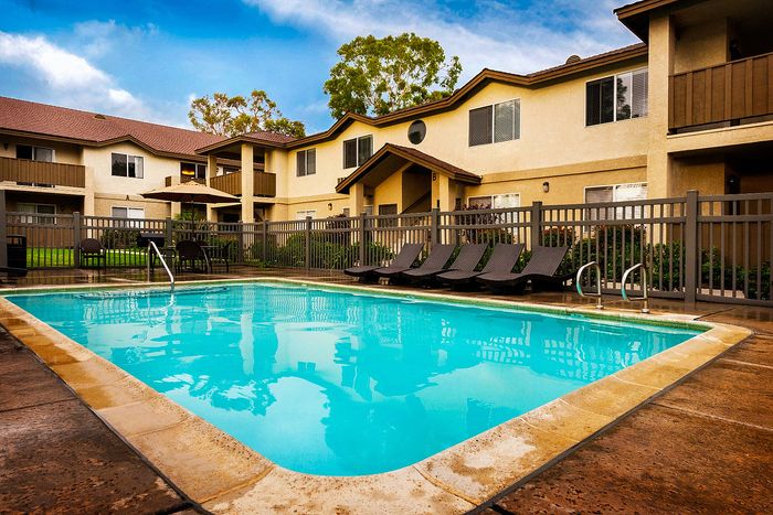 Sparkling swimming pool and gated sun deck at Elan - poway hills.