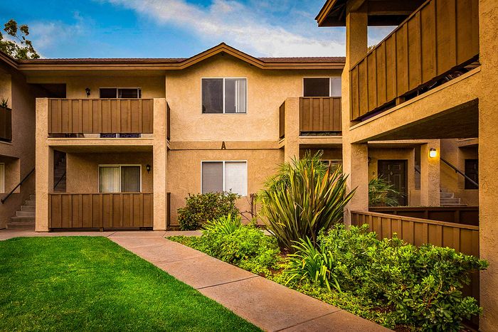 Apartment building exterior with private balconies and patios at Elan - poway hills.