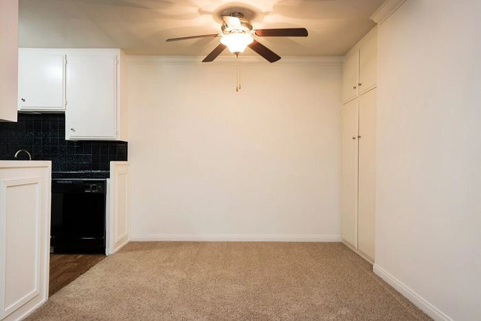 Dining area featuring a ceiling fan and neutral carpeting at Elan - bella mer coronado.