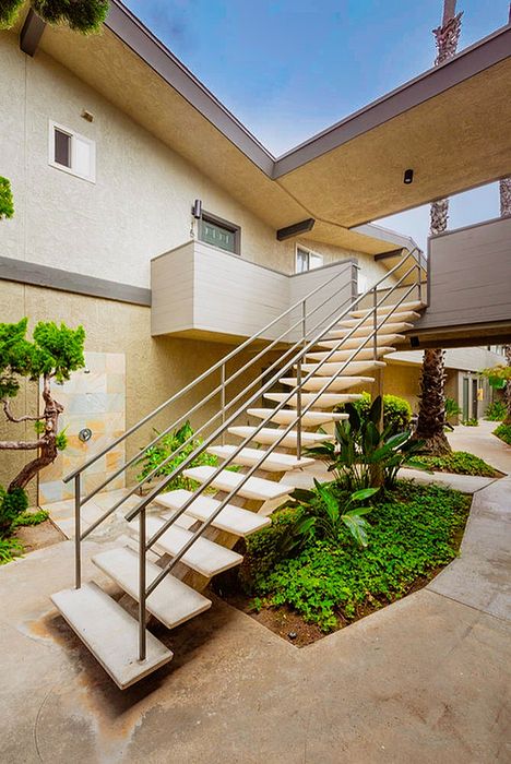 Landscaped community courtyard and outdoor staircase at Elan - beachhouse del mar