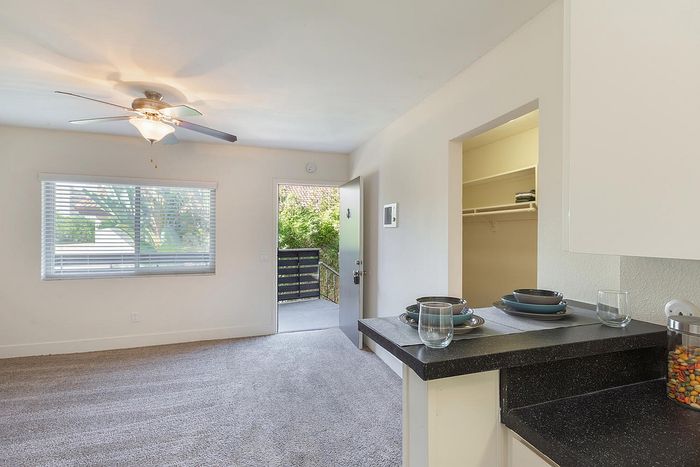 Bright interior with a breakfast bar and balcony view at Elan - beachlofts del mar