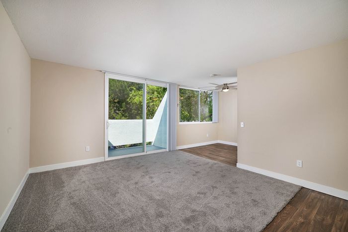 lving room with plush carpet and wood-like flooring at Creekwood Villas