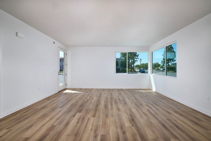 living room with wood-like flooring at Dezi