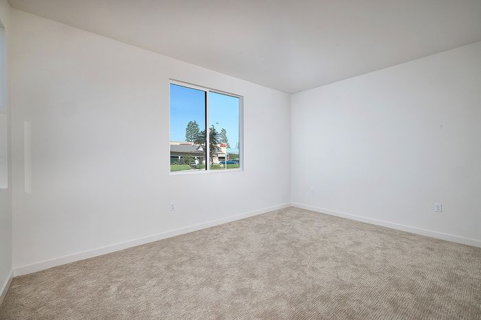 bedroom with plush carpet at Dezi
